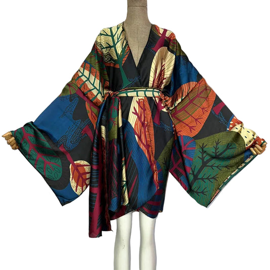 Colorful patterned kimono-style garment on a mannequin with WINYI branding.