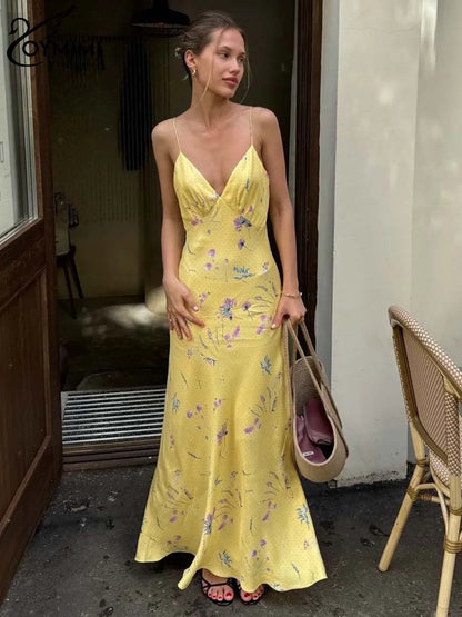 Vestido casual amarillo con tirantes finos y estampado de Oymimi, largo hasta los tobillos y espalda abierta