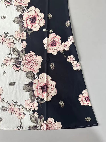 Floral fabric with pink flowers on a black background