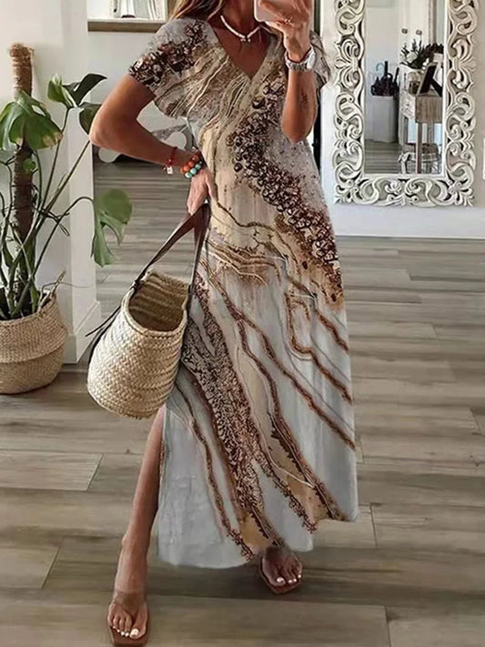 Woman in a patterned dress holding a woven bag in a home setting.